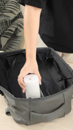 A traveler using the Air Pump inside a travel backpack