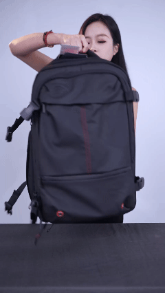 A customer demonstrating the AirCarryo backpack compartments